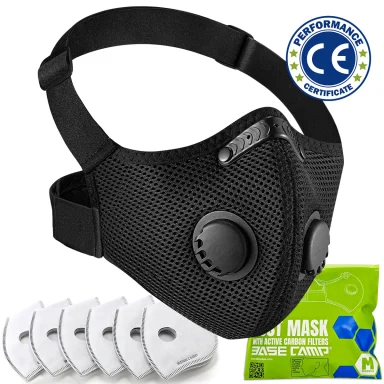 Black BASE CAMP M Pro dust mask with green filter detail.