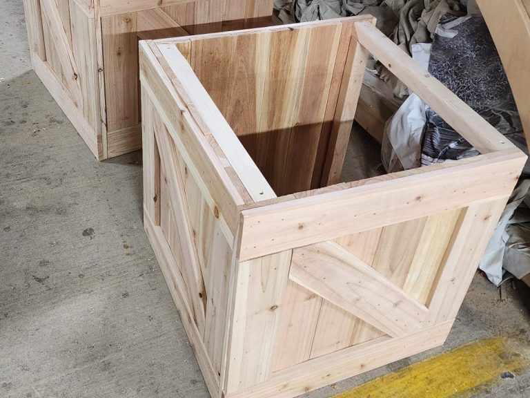 Spice Routes Crate Open wooden crate frame under construction on a workshop floor.