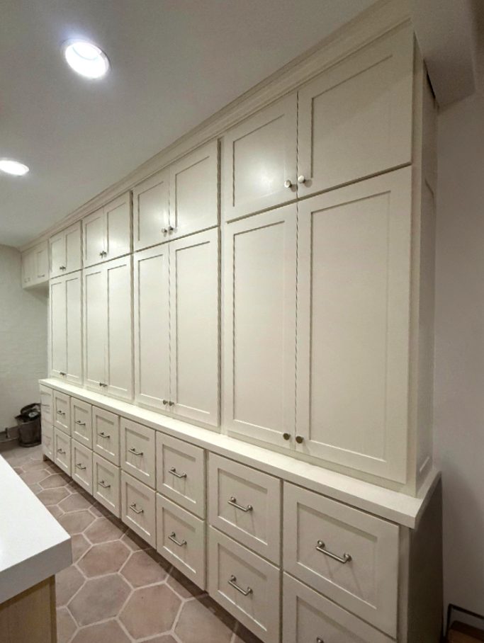 Floor to ceiling custom built-in cabinets with shaker style doors