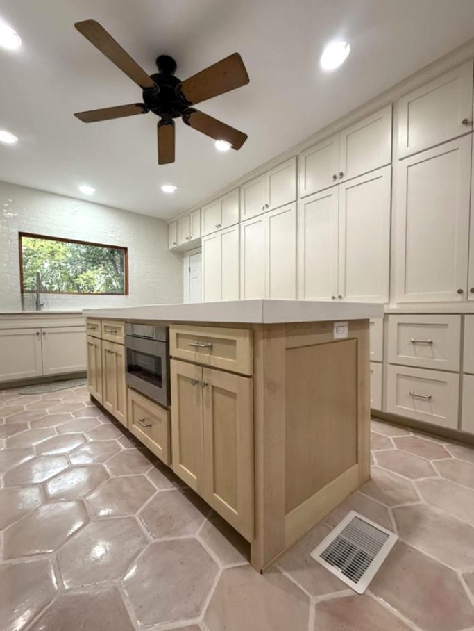 Large kitchen island with custom wood cabinetry