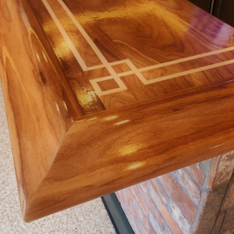 Archit wood surface fabricated to integrate with built-in cabinetry.