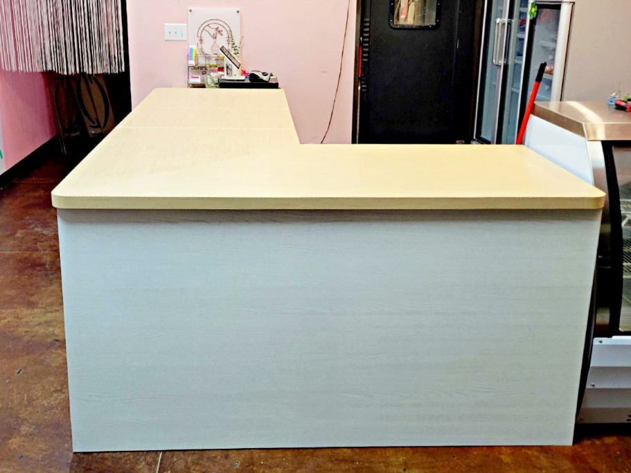 Café service counter extension with angled transaction surface