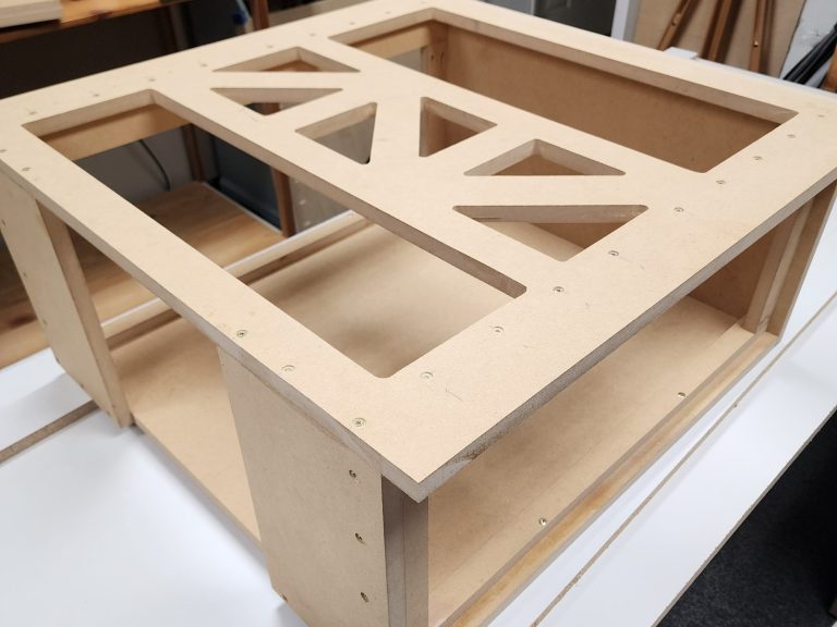 MDF rectangular enclosure with diagonal cross bracing for projector.