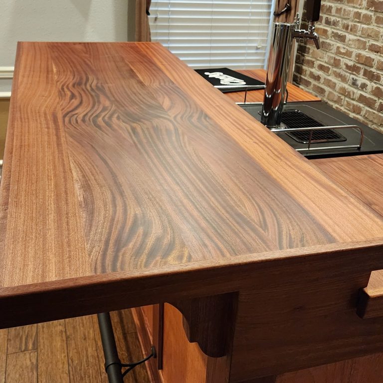 Finished solid wood bar top installed in a residential bar in Texas